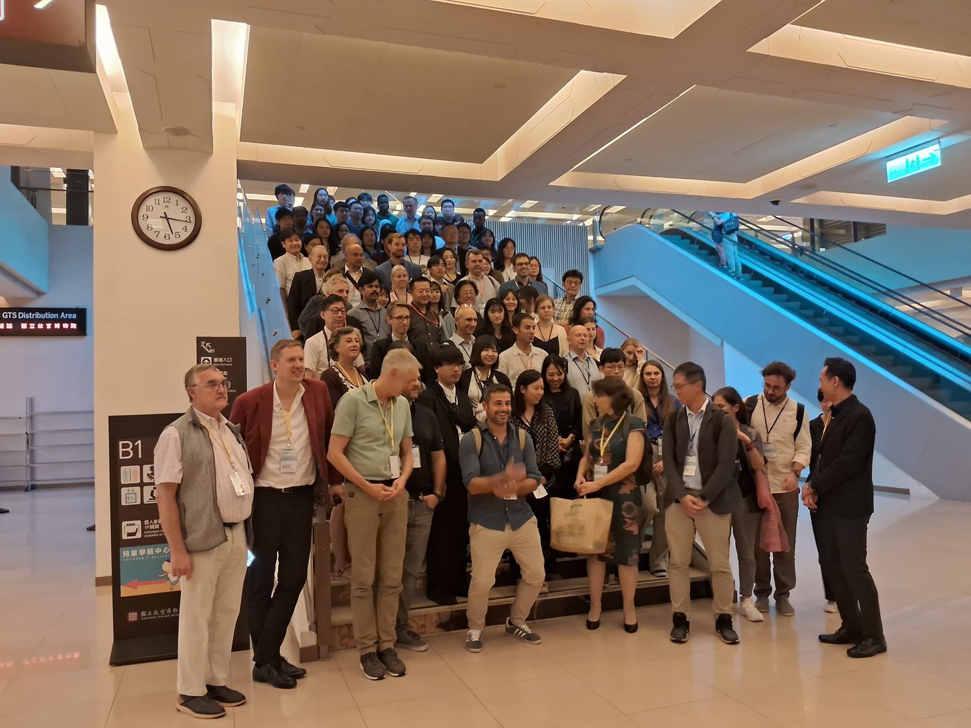 Group photo of award winners and attendees on the staircase at the 64th ICBL in Taipei